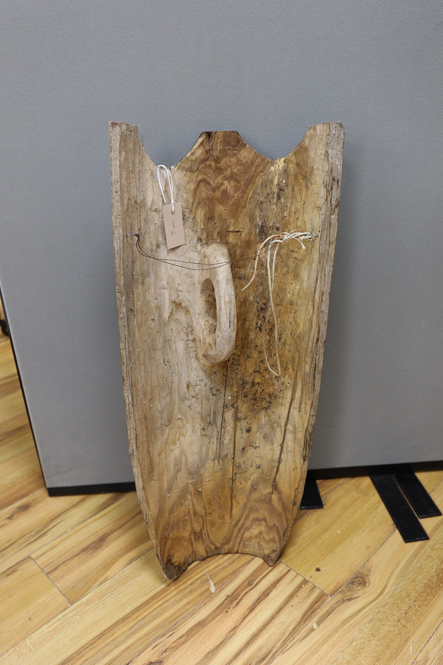 A tribal carved wood shield, inscribed Tasha Andy 16 4 08, 77cm